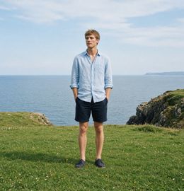 Someone standing on a clifftop lawn