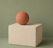 Sculptural still life with a terracotta sphere